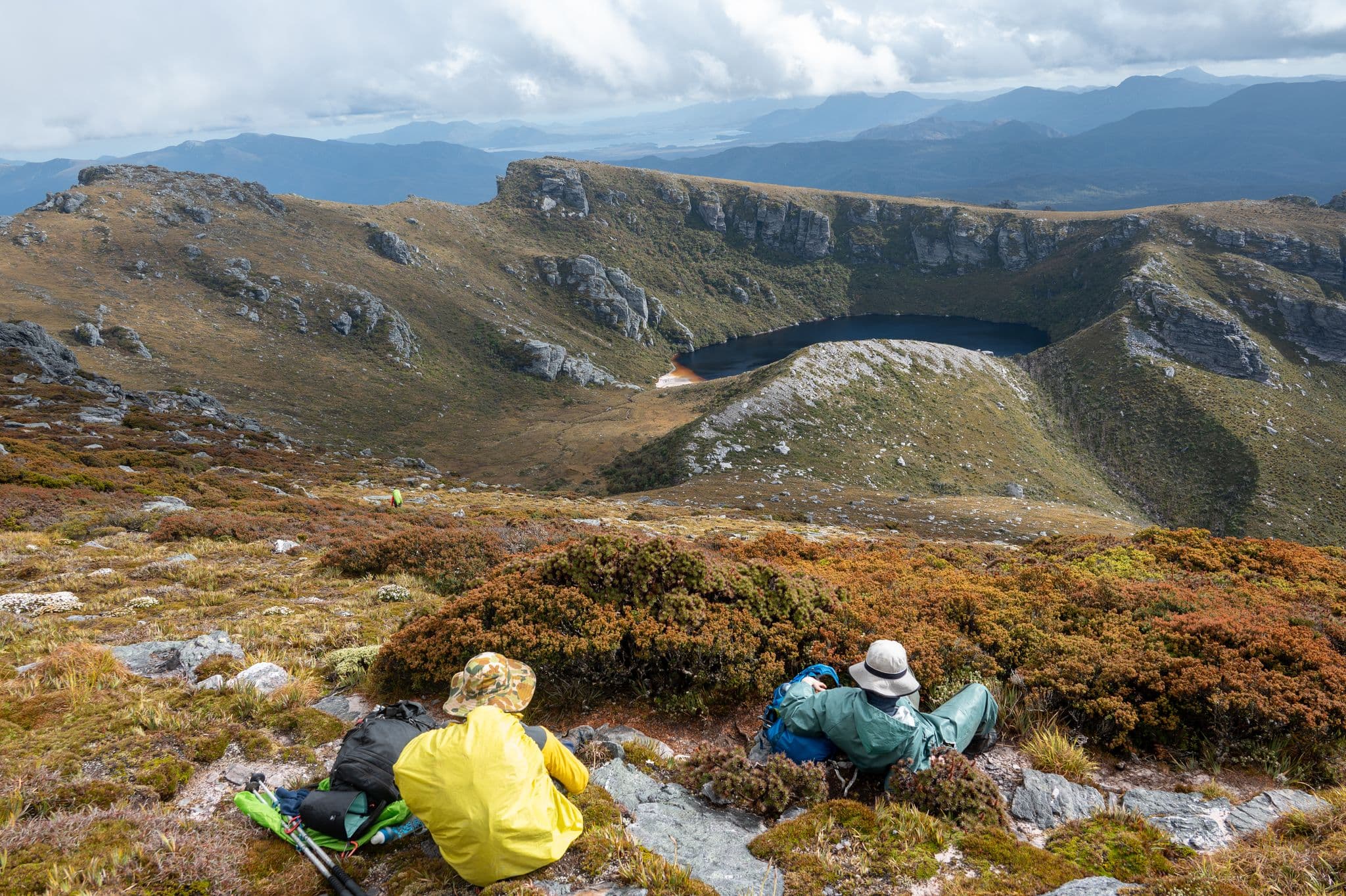 A quick rest after a gruelling 900m climb up Alpha Moraine. Lake Fortuna in the background. Photo Credit - Craig Pearce