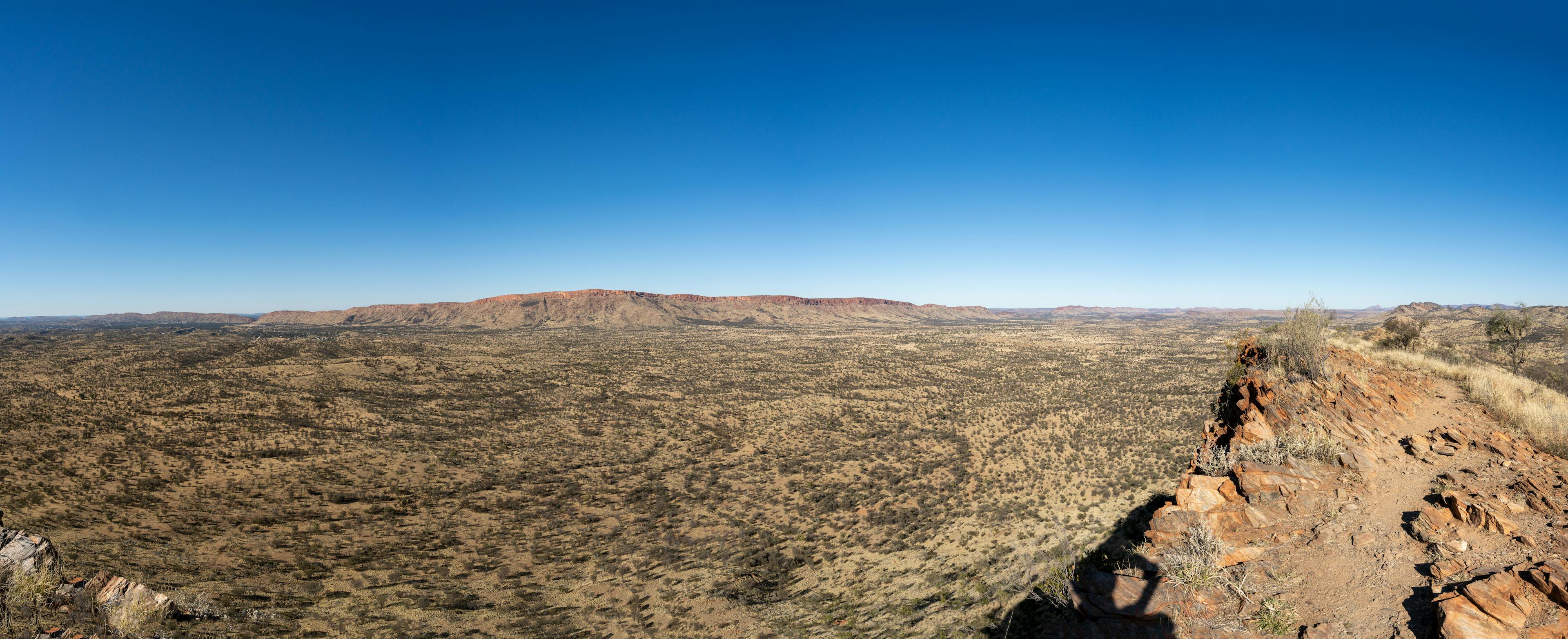 Protruding landscapes and large sweeping plains. To the left; Alice Springs, and the 'gap', the large break in the wall that separates the town from the vast expansive central desert of Australia. 