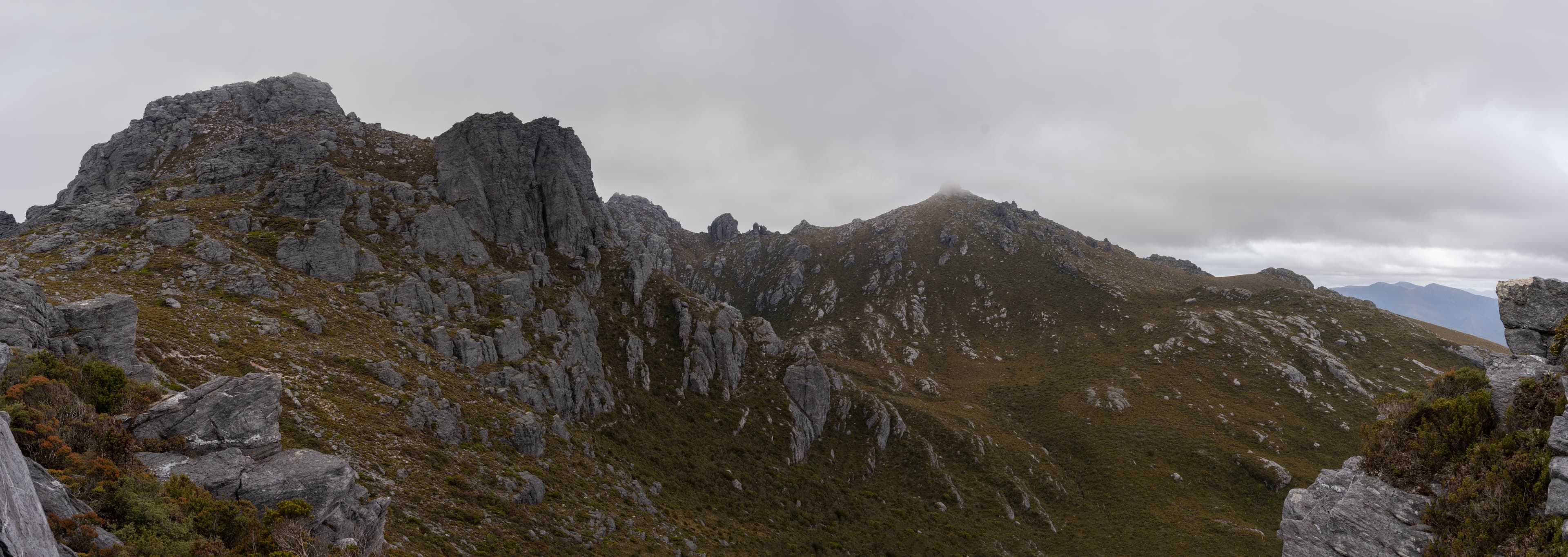 Gazing ahead, the track descends below Procyon Peak. In the dip, lies Square Lake, and Oberon, over the next next saddle between Mount Orion and Mount Sirius