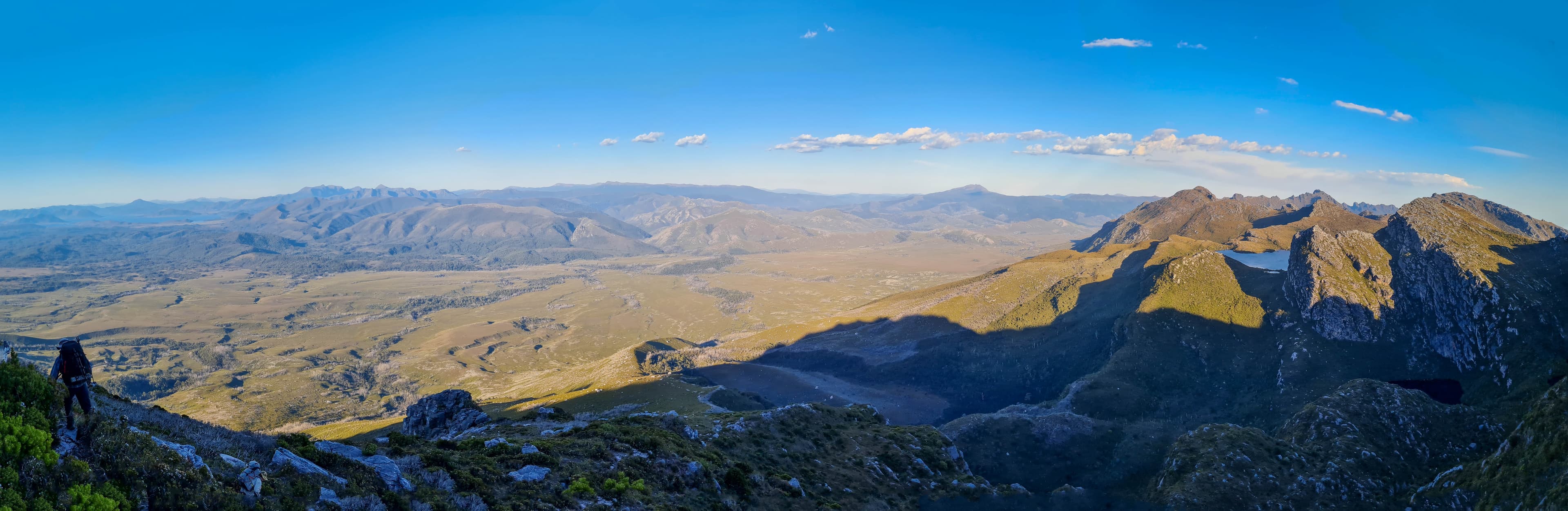 The vast sweeping Arthur Plains, with the beginning of the Eastern Arthurs on the right. Promontory Lake just visible.