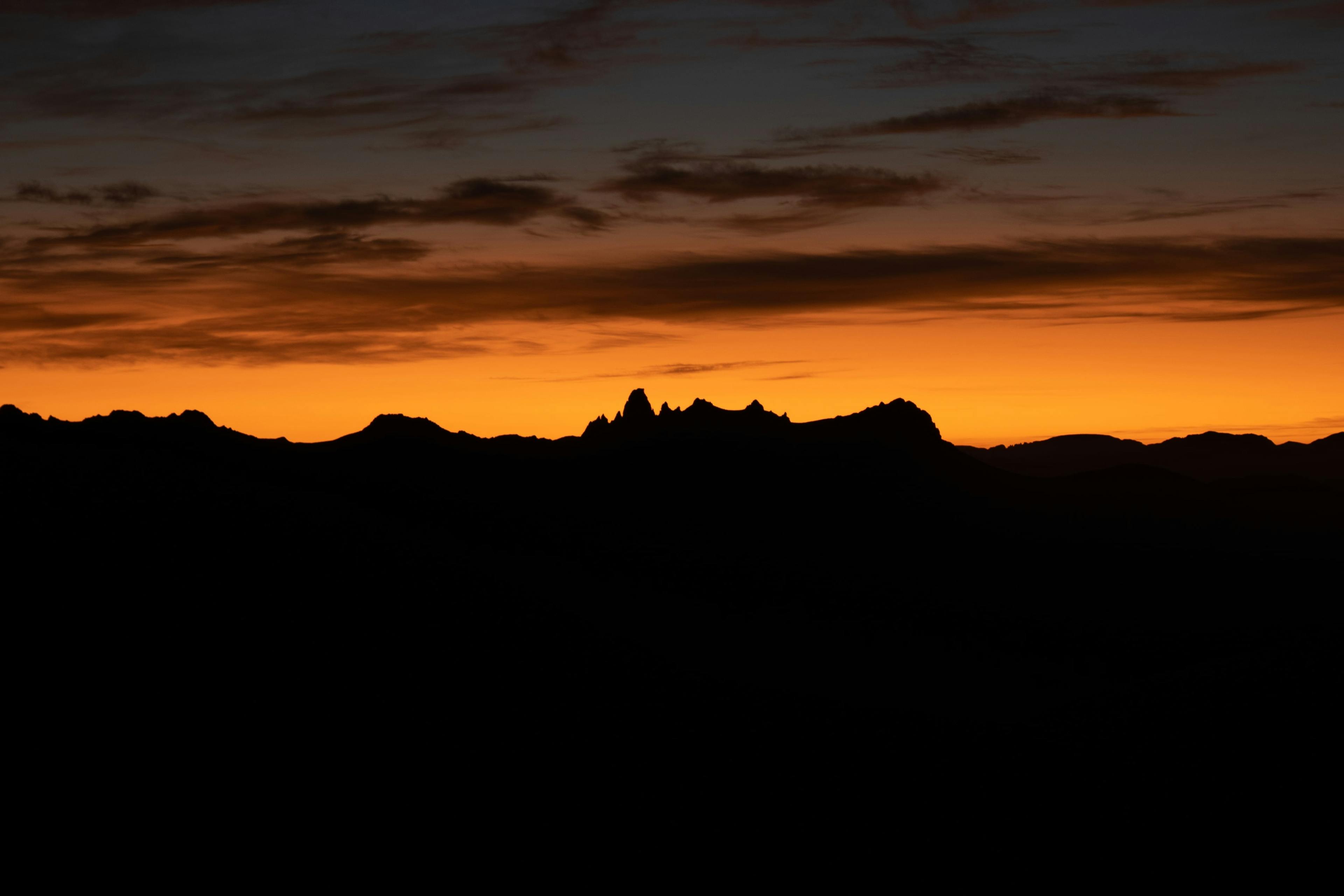 Sunrise overlooking Federation Peak. The distinct hook of the peak makes it unmistakable. 