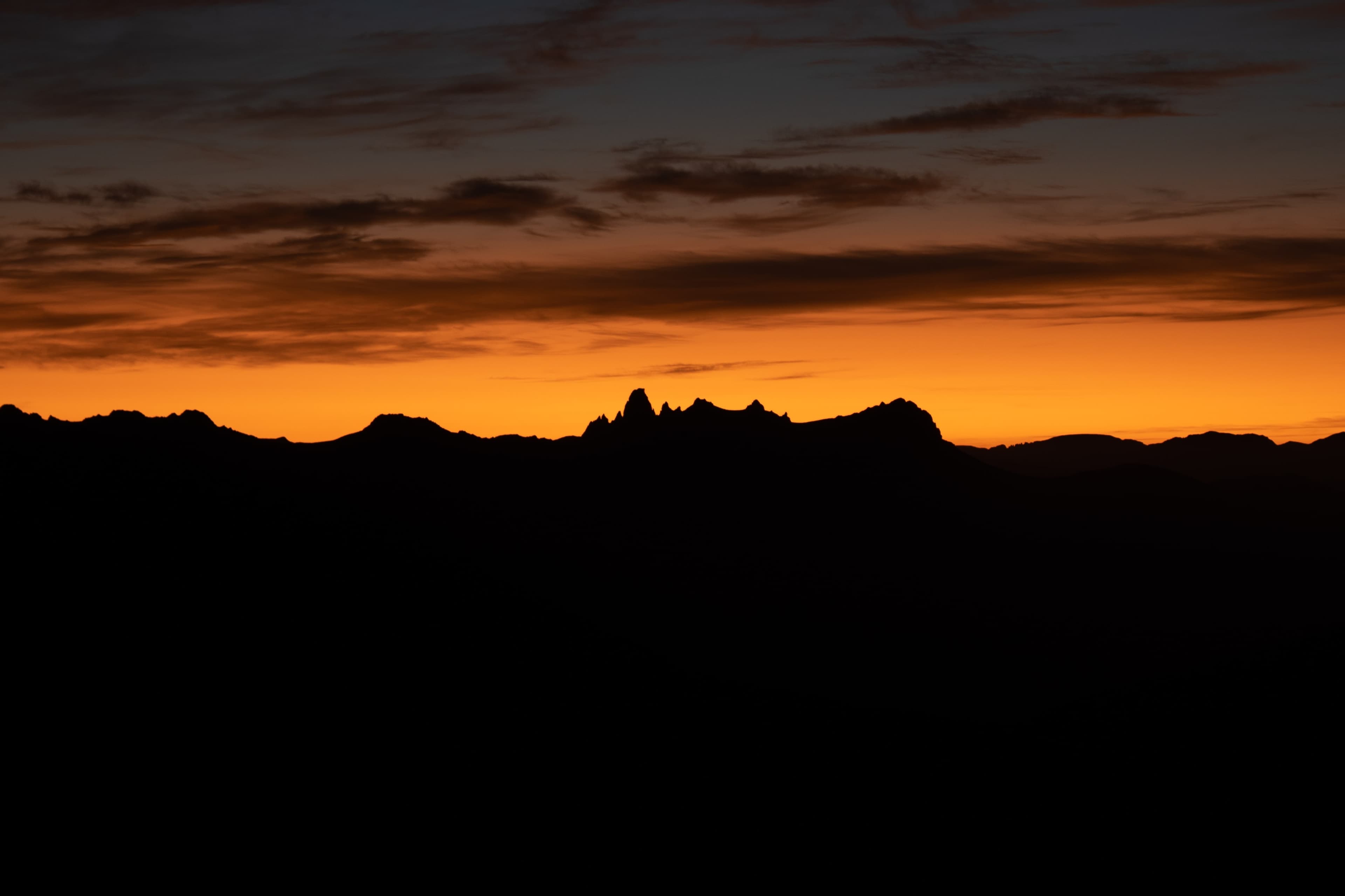 Sunrise overlooking Federation Peak. The distinct hook of the peak makes it unmistakable. 