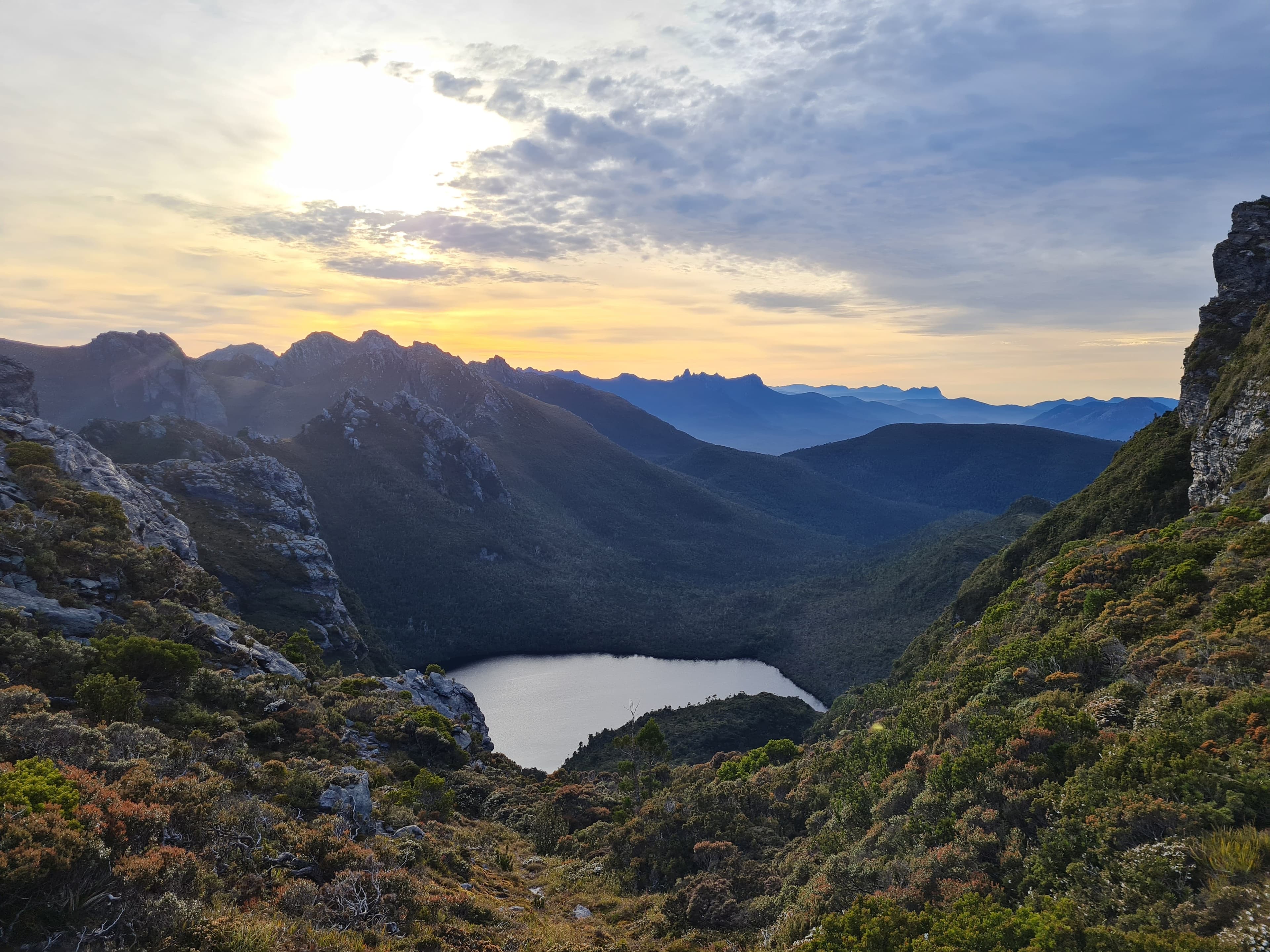 Federation Peak just after sunrise with Lake Ganymede in the foreground.