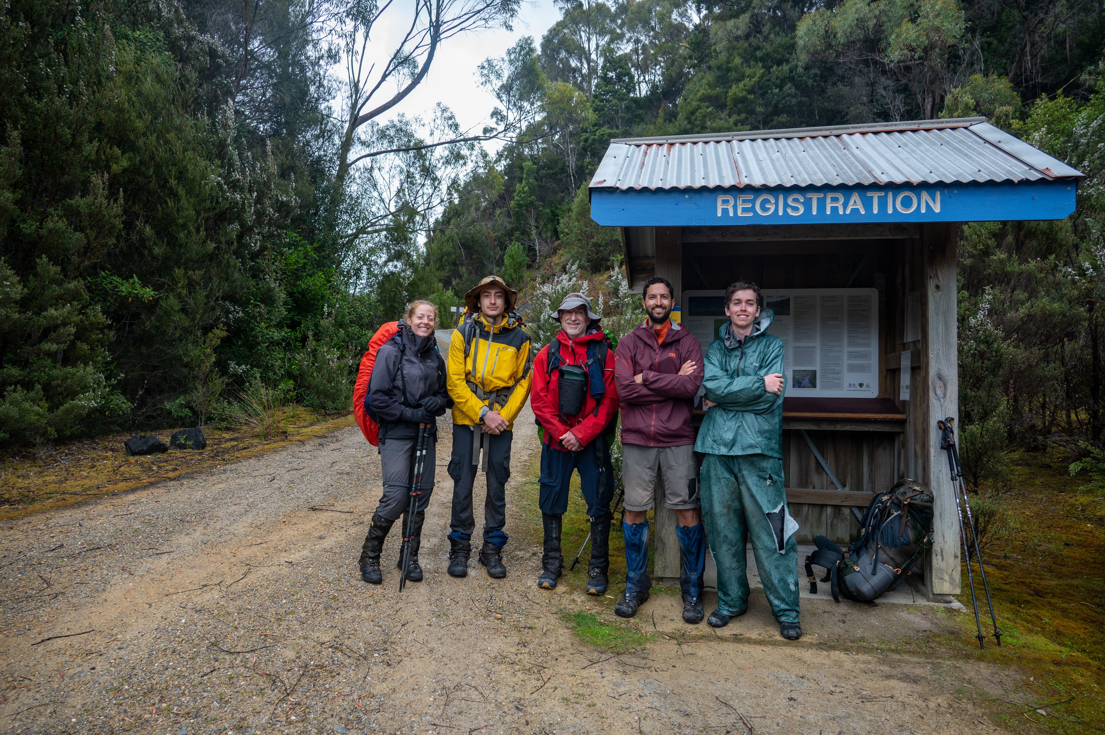 Tired, cold, soaked but all smiles. We made it... in one piece. Photo Credit - Craig Pearce